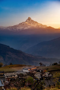 Scenic view of mountains against sky during sunset