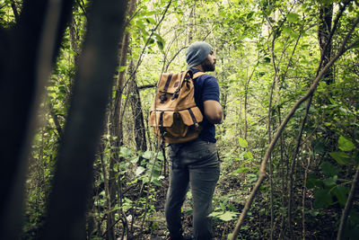 Full length of a man walking in forest