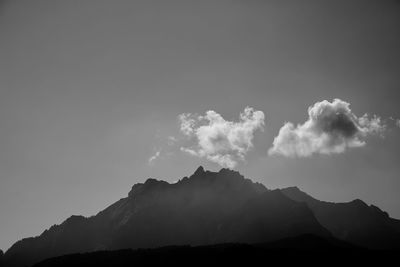 Low angle view of silhouette mountain against sky