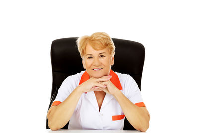 Portrait of a smiling woman sitting on chair