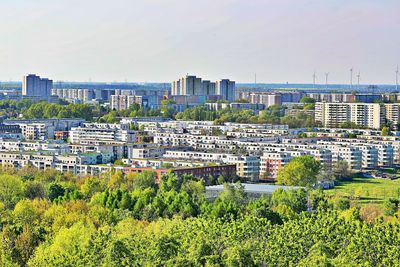 High angle view of trees and buildings against sky