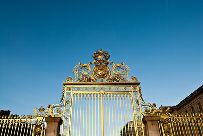 Low angle view of historical building against blue sky