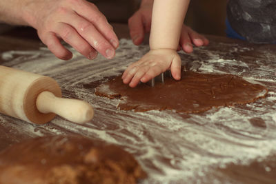 Cropped image of person preparing food on table