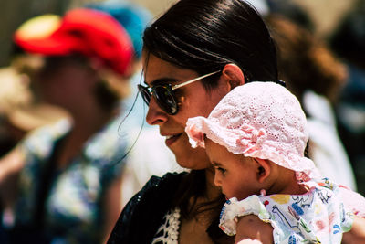 Rear view of woman with baby outdoors