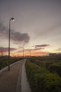 Street against sky during sunset