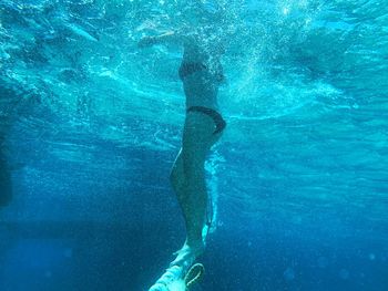 Man swimming in pool