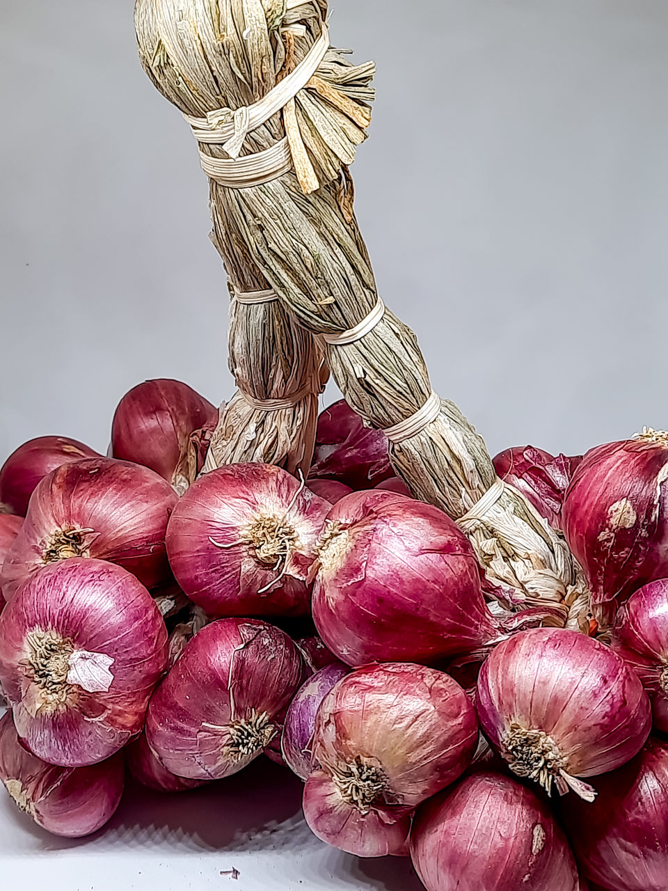 food and drink, food, produce, freshness, vegetable, healthy eating, wellbeing, still life, plant, shallot, flower, ingredient, no people, studio shot, indoors, garlic, large group of objects, organic, onion, gray background, abundance, spice, raw food, close-up, garlic bulb, red onion