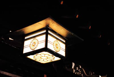 Low angle view of illuminated lantern at night