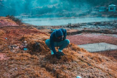 Man working at shore