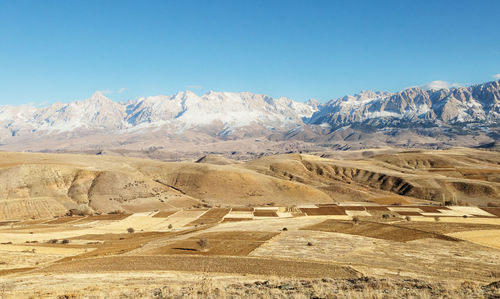 Scenic view of desert against clear sky