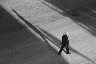 Shadow of woman on road