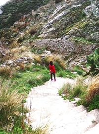 Full length of woman walking on mountain