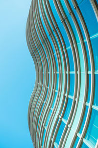 Low angle view of spiral staircase against blue sky