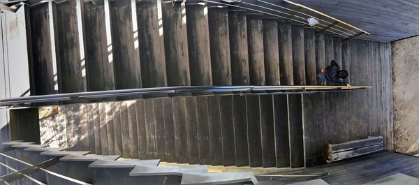 High angle view of boy moving down on steps