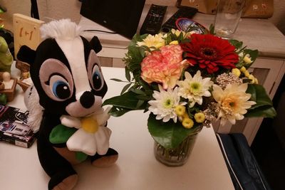 High angle view of various flowers in vase on table