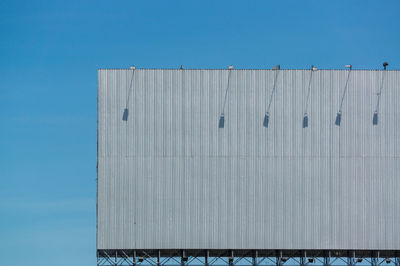 Low angle view of building against blue sky