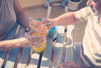 Senior couple enjoying wine at outdoors restaurant