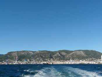 Scenic view of sea against clear blue sky