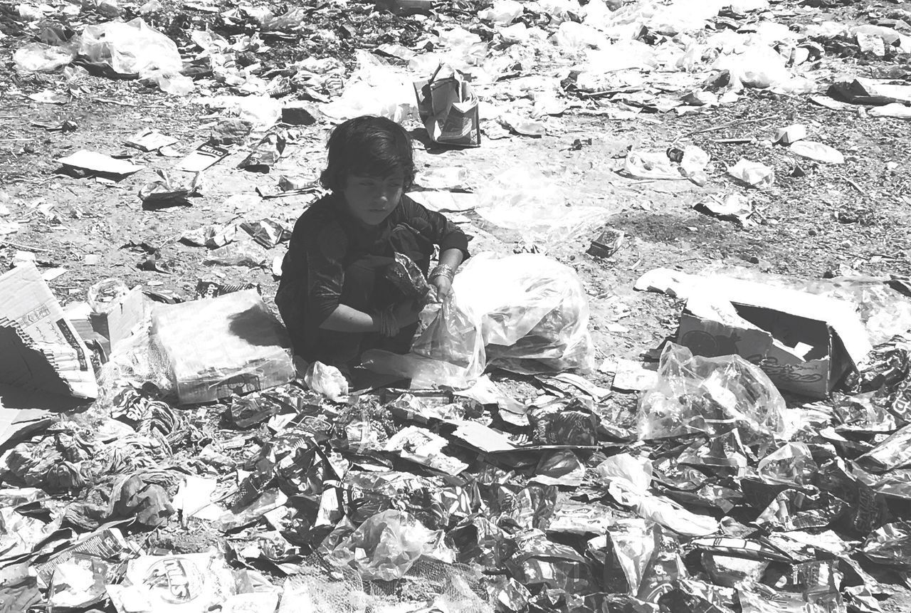 FULL LENGTH OF BOY SITTING ON FLOOR