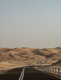 Scenic view of desert against clear sky