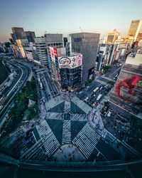 High angle view of city street and buildings against sky