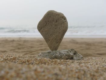 Close-up of stone on beach