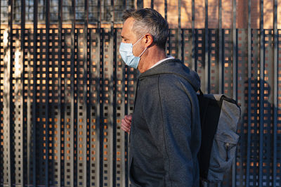 Midsection of man standing outdoors