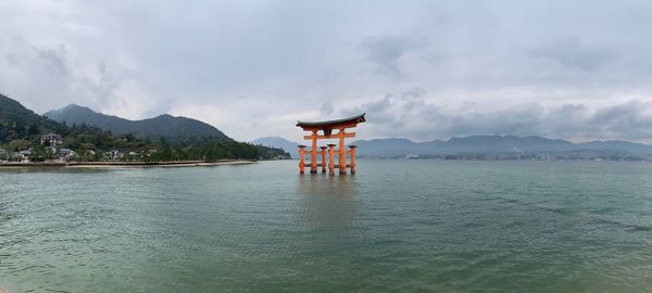 Scenic view of sea against cloudy sky