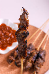 Close-up of ice cream on barbecue grill