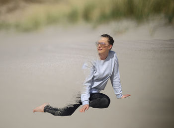 Full length of young man jumping in water