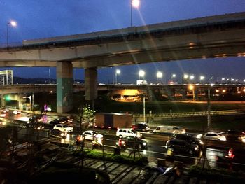 Cars on road in city against sky