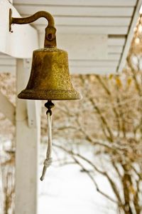 Close-up of old metallic bell at entrance