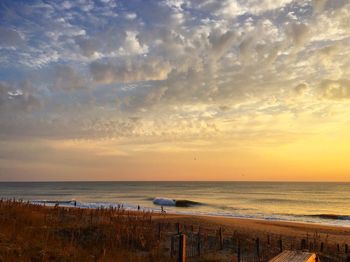 Scenic view of sea against cloudy sky