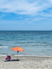 Scenic view of beach against sky