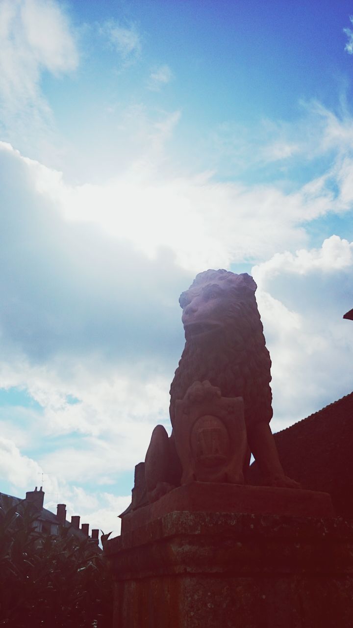 sky, architecture, built structure, low angle view, cloud - sky, religion, building exterior, place of worship, history, spirituality, statue, art and craft, sculpture, famous place, temple - building, art, human representation, travel destinations, cloud