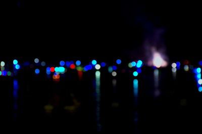 Defocused image of illuminated lights at night