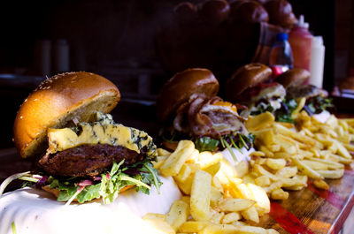 Close-up of burgers on table