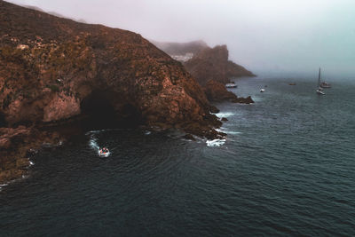 High angle view of rocks in sea