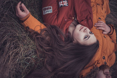 Portrait of young woman lying down