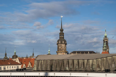 Buildings in city against sky