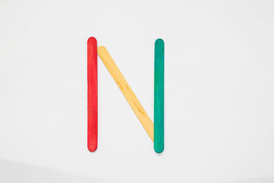 Close-up of colored pencils against white background