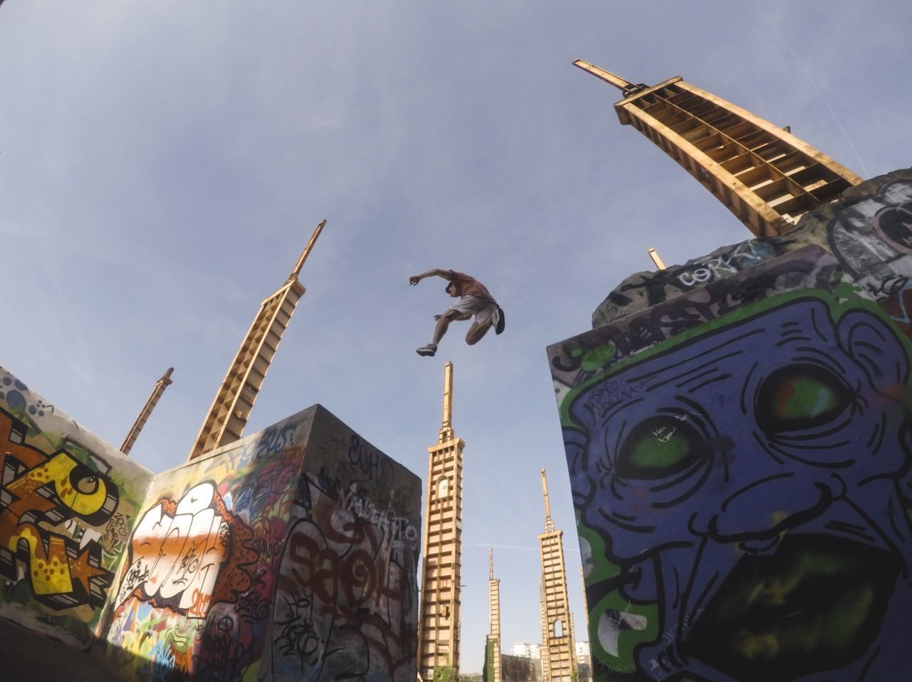 LOW ANGLE VIEW OF BIRDS PERCHING ON STATUE OF BUILDING