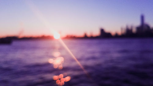 Close-up of sea against sky during sunset