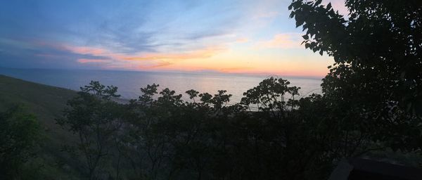 View of calm sea at sunset