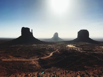 Rock formations on landscape against sky