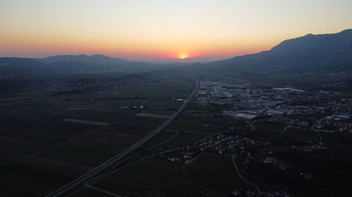 High angle view of cityscape against sky during sunset