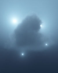 Low angle view of moon in sky at night