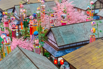 Low angle view of multi colored lanterns hanging on building