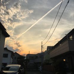 Low angle view of buildings at sunset