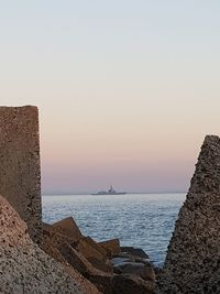 Scenic view of sea against clear sky during sunset